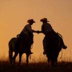 9797871960340-Ranchers Shaking Hands on Horseback 163000