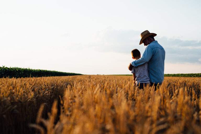 Farmer,And,His,Son,Walking,Fields,Of,Wheat